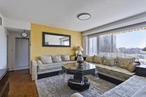 This bright 2-bedroom apartment with a 16 m² terrace is located on the 4th floor and offers lovely green views. Nestled in a quiet residential area, it offers comfort and privacy.

The entrance hall with built-in closets leads to a separate kitchen and a