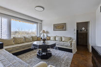 This bright 2-bedroom apartment with a 16 m² terrace is located on the 4th floor and offers lovely green views. Nestled in a quiet residential area, it offers comfort and privacy.

The entrance hall with built-in closets leads to a separate kitchen and a