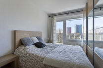 This bright 2-bedroom apartment with a 16 m² terrace is located on the 4th floor and offers lovely green views. Nestled in a quiet residential area, it offers comfort and privacy.

The entrance hall with built-in closets leads to a separate kitchen and a