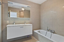 Unique opportunity: Move-in ready ground-floor apartment with two bedrooms, two terraces, a private garden, and a large shared garden with pond. Located in a small-scale residence of just eight units, within walking distance of Grimbergen’s center and r