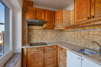 This duplex apartment on the second floor offers 2 bedrooms, 2 bathrooms, 2 toilets, and a southwest-facing terrace. It is part of a small-scale co-ownership with only three apartments.

The entrance hall leads to the spacious living area, divided into tw