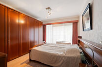 This spacious 2-bedroom apartment, featuring 2 terraces, a private garage box, and a parking space, is located on the third floor of a well-maintained residential building.

LAYOUT:
The entrance hall leads to a bright living room with a dining area and a 