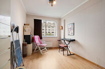 This spacious 2-bedroom apartment, featuring 2 terraces, a private garage box, and a parking space, is located on the third floor of a well-maintained residential building.

LAYOUT:
The entrance hall leads to a bright living room with a dining area and a 