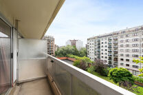 This spacious 2-bedroom apartment, featuring 2 terraces, a private garage box, and a parking space, is located on the third floor of a well-maintained residential building.

LAYOUT:
The entrance hall leads to a bright living room with a dining area and a 