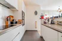 This recent two-bedroom family home with a pleasant terrace/garden is quietly located at the rear of a residential building, right in the center of Brussels. The property is part of a well-maintained co-ownership and includes an underground parking space 